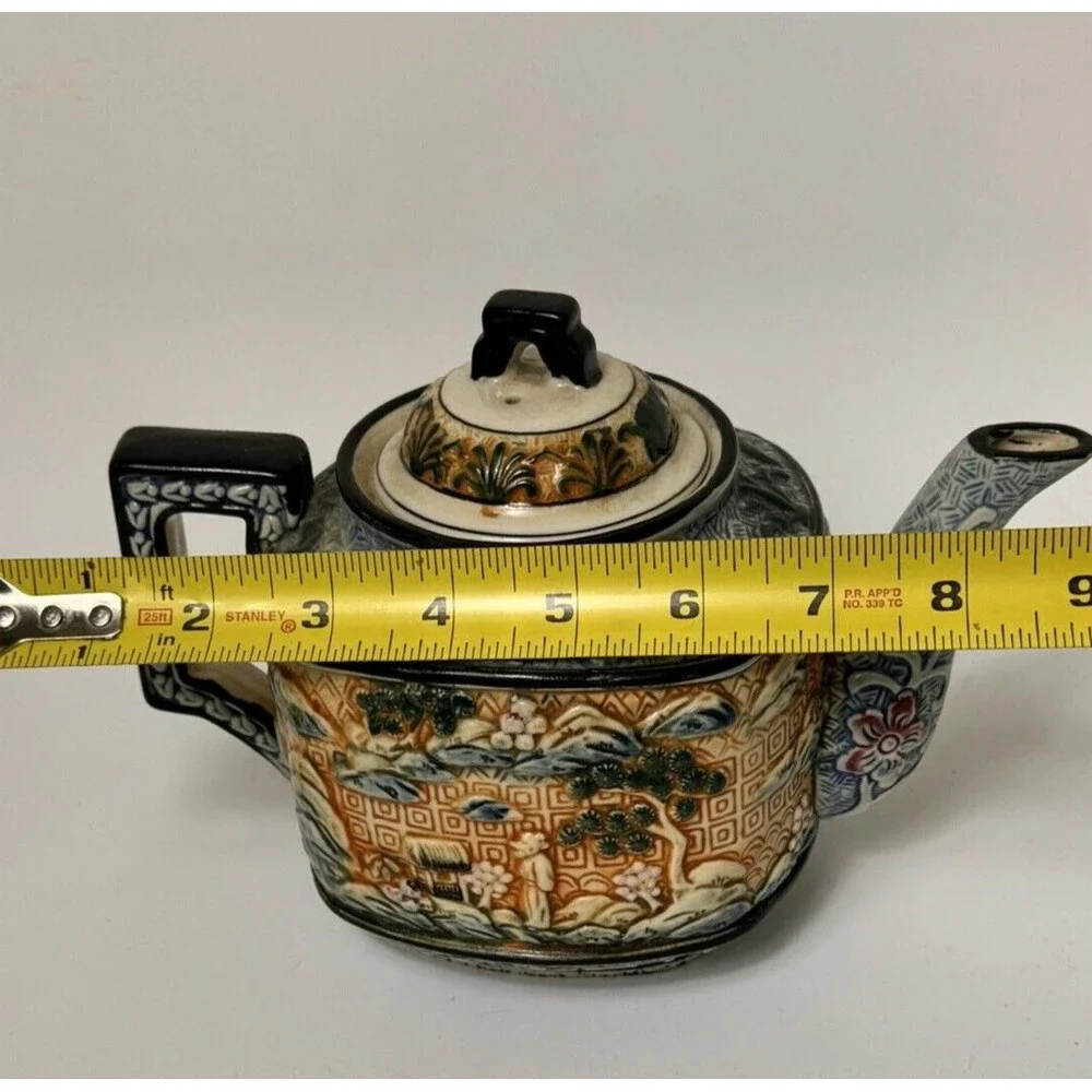 Teapot- vintage ceramic raised Asian  9 inches by 7 Inches